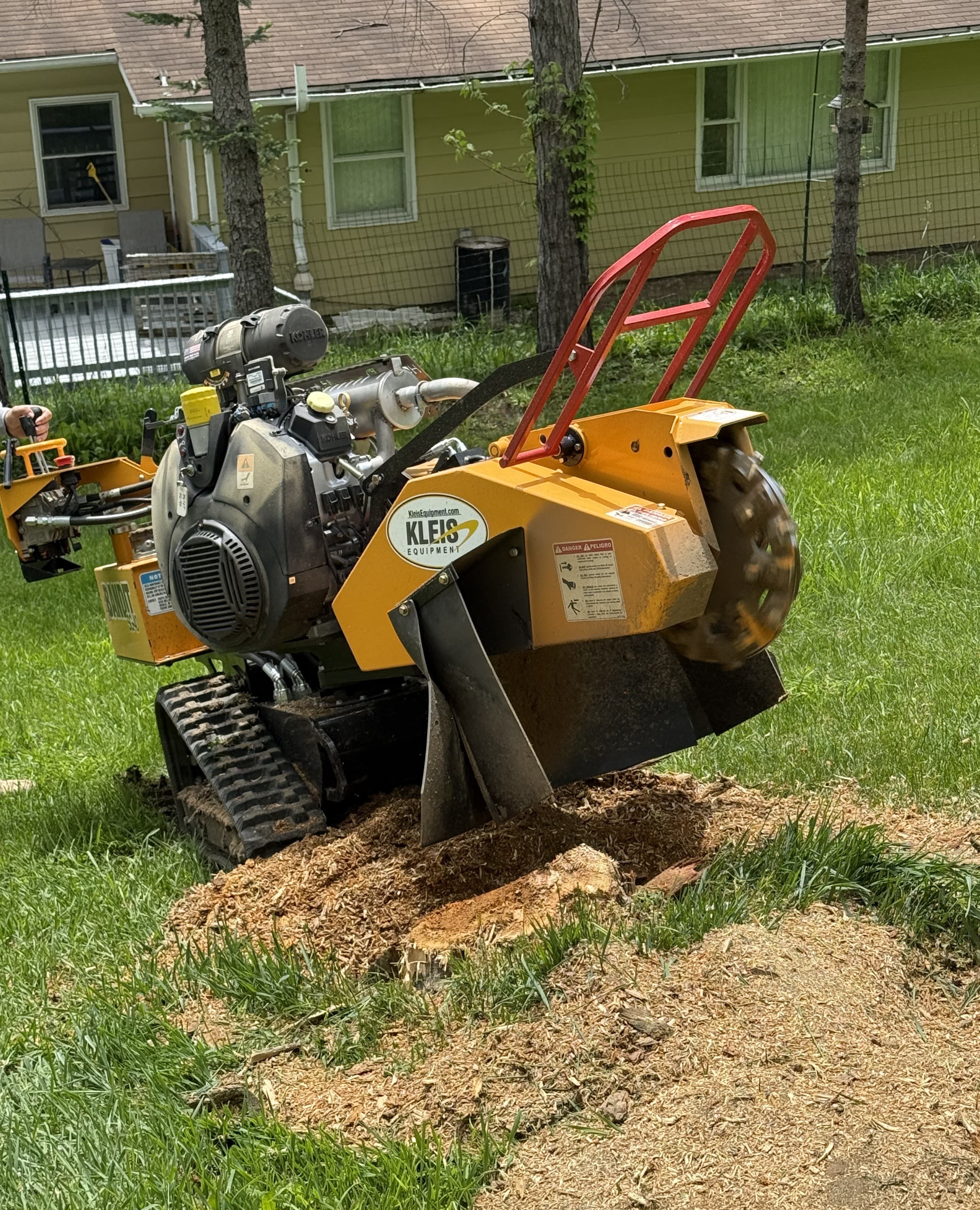 Professional stump grinding equipment in action